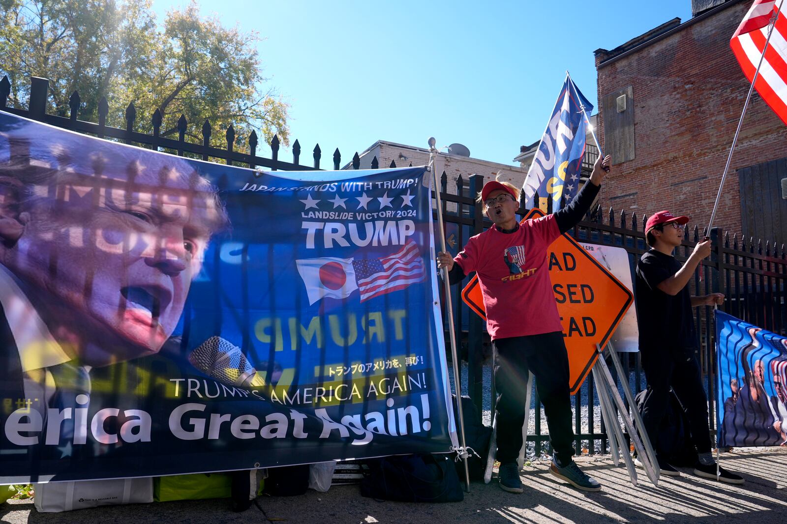 Supporters of Republican presidential nominee former President Donald Trump gather outside the Lancaster Convention Center in Lancaster, Pa., Sunday, Oct. 20, 2024, where Trump will hold a town hall. (AP Photo/Susan Walsh)