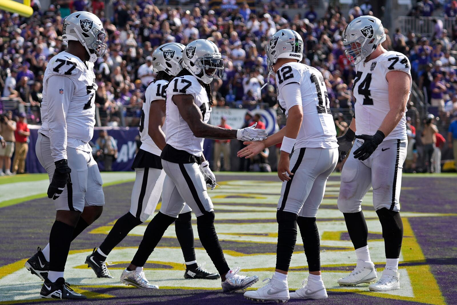 Las Vegas Raiders wide receiver Davante Adams (17) celebrates after scoring a touchdown against the Baltimore Ravens during the second half of an NFL football game, Sunday, Sept. 15, 2024, in Baltimore. (AP Photo/Stephanie Scarbrough)