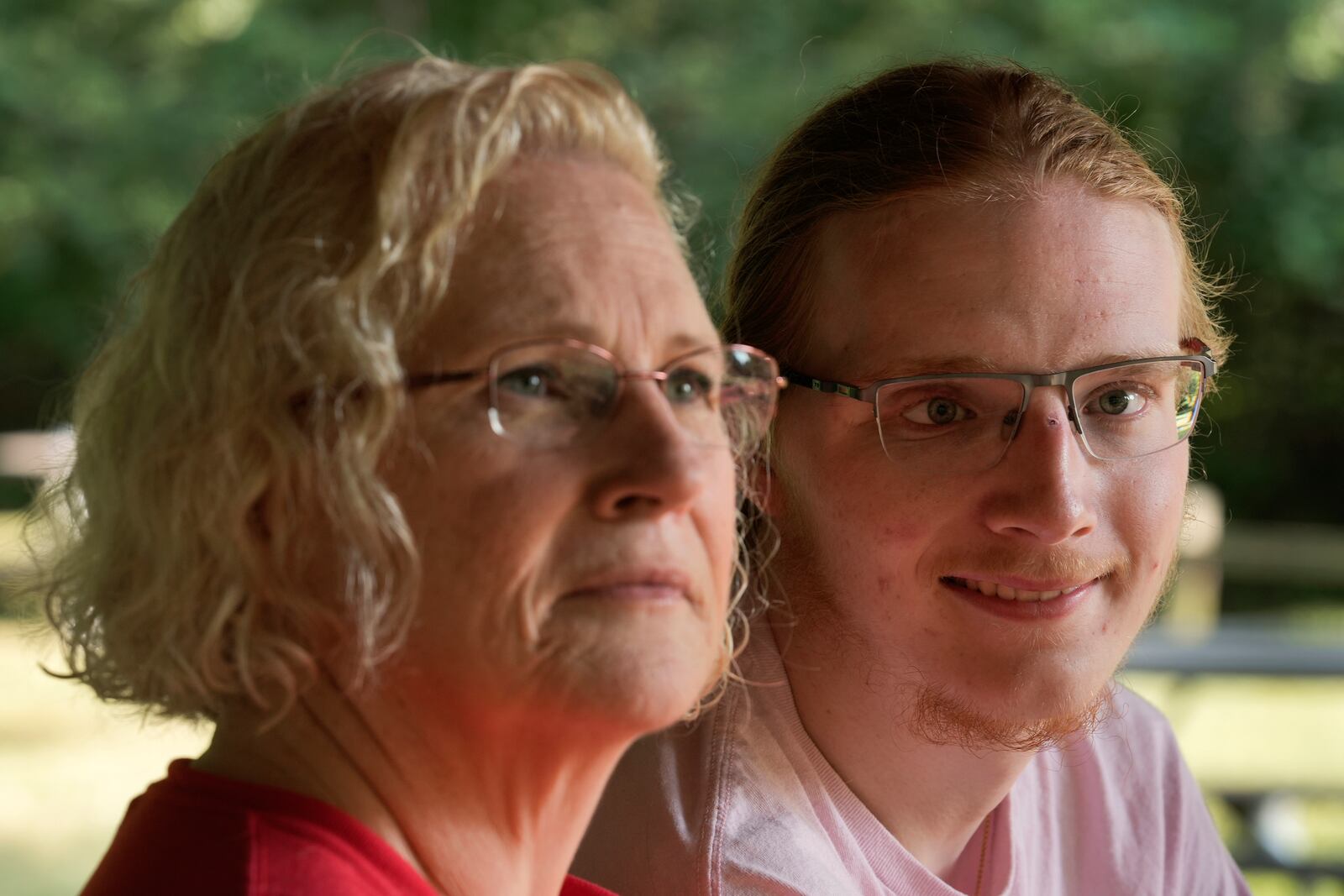 Denise Wieck and her son Guy Boyd, who was shot in the eye with a ghost gun, pose in Ypsilanti, Mich., Saturday, Sept. 14, 2024. (AP Photo/Paul Sancya)