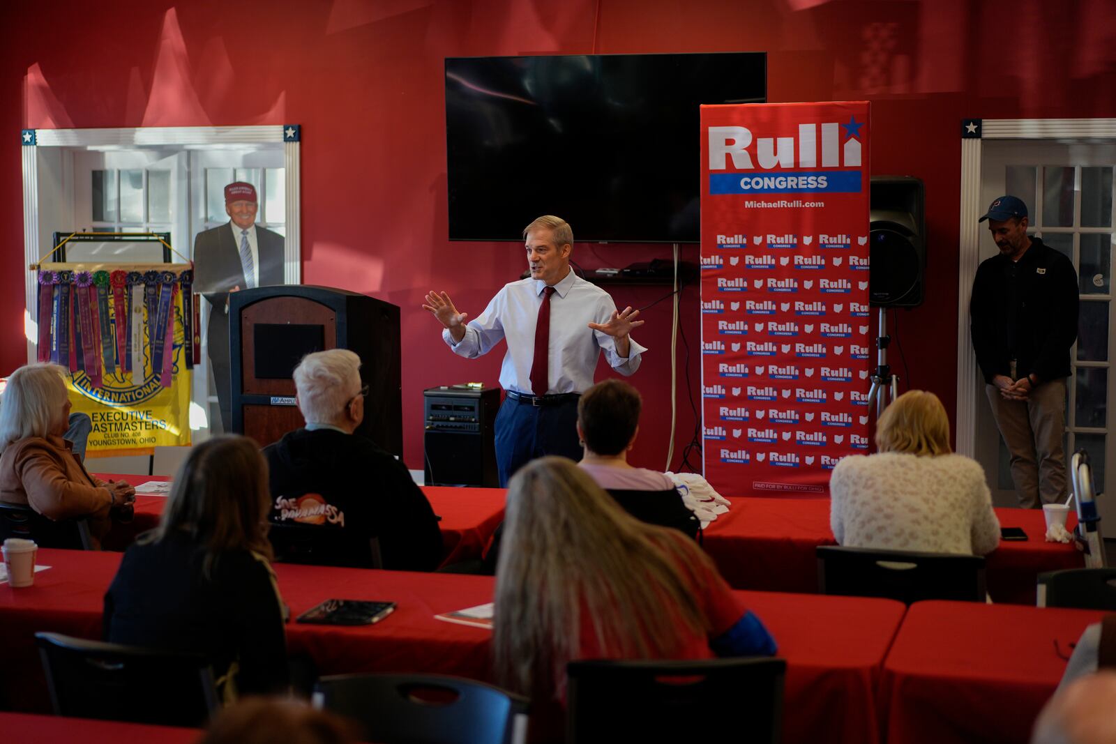 Rep. Jim Jordan, R-Ohio, speaks at a rally for Rep. Michael Rulli, R-Ohio, standing right, at the Mahoning County Republican Party headquarters in Boardman, Ohio, Thursday, Oct. 17, 2024. A cardboard cutout of Republican presidential nominee former President Donald Trump is seen left. (AP Photo/Carolyn Kaster)