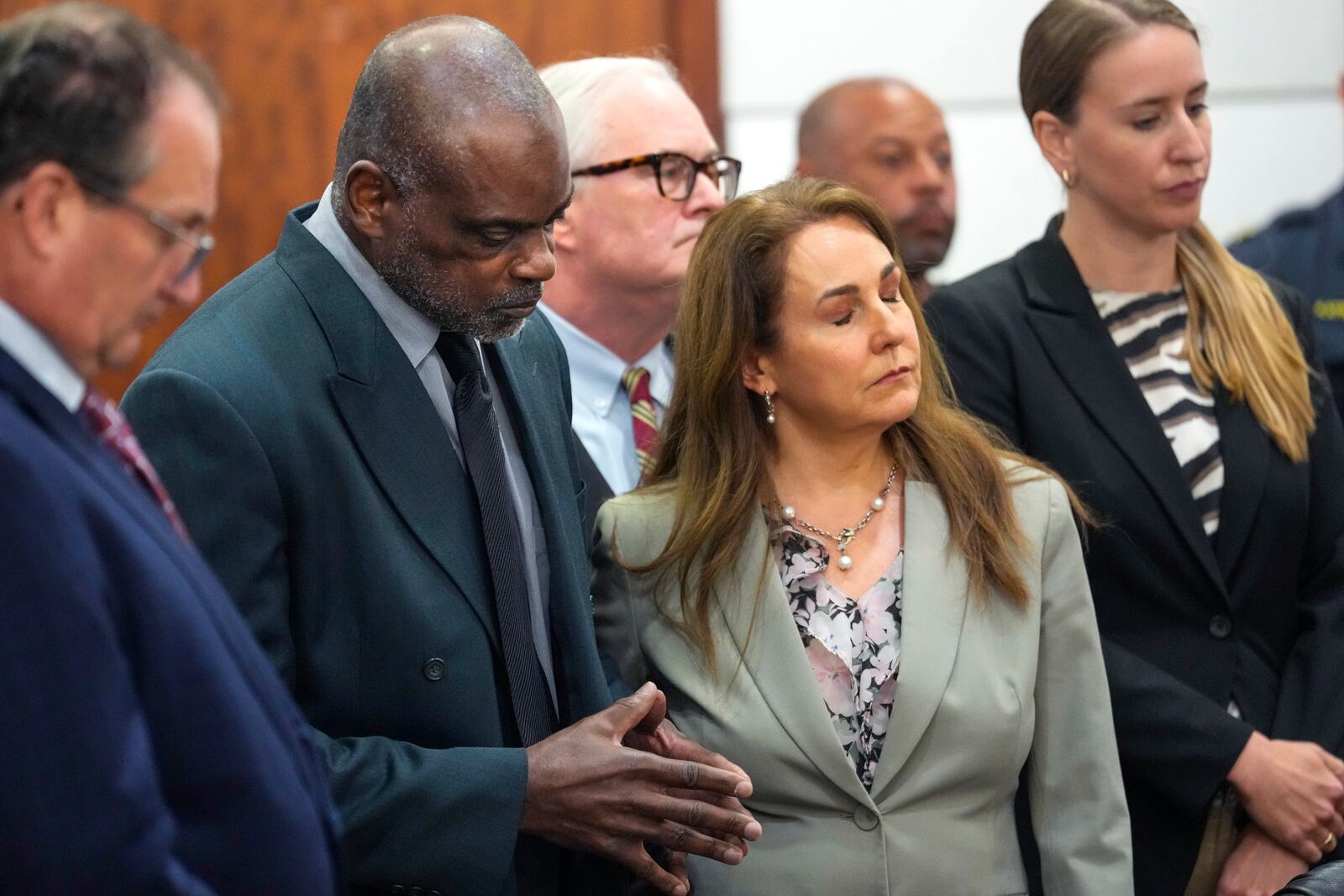 Former Houston police officer Gerald Goines stands with his lawyer, Nicole Deborde Hochglaube, and his defense team as the verdict sentencing him to 60 years behind bars on a pair of felony murder convictions on Tuesday, Oct. 8, 2024 in Houston. Goines was found guilty of felony murder in the 2019 deaths of Dennis Tuttle and Rhogena Nicholas. (Brett Coomer/Houston Chronicle via AP)