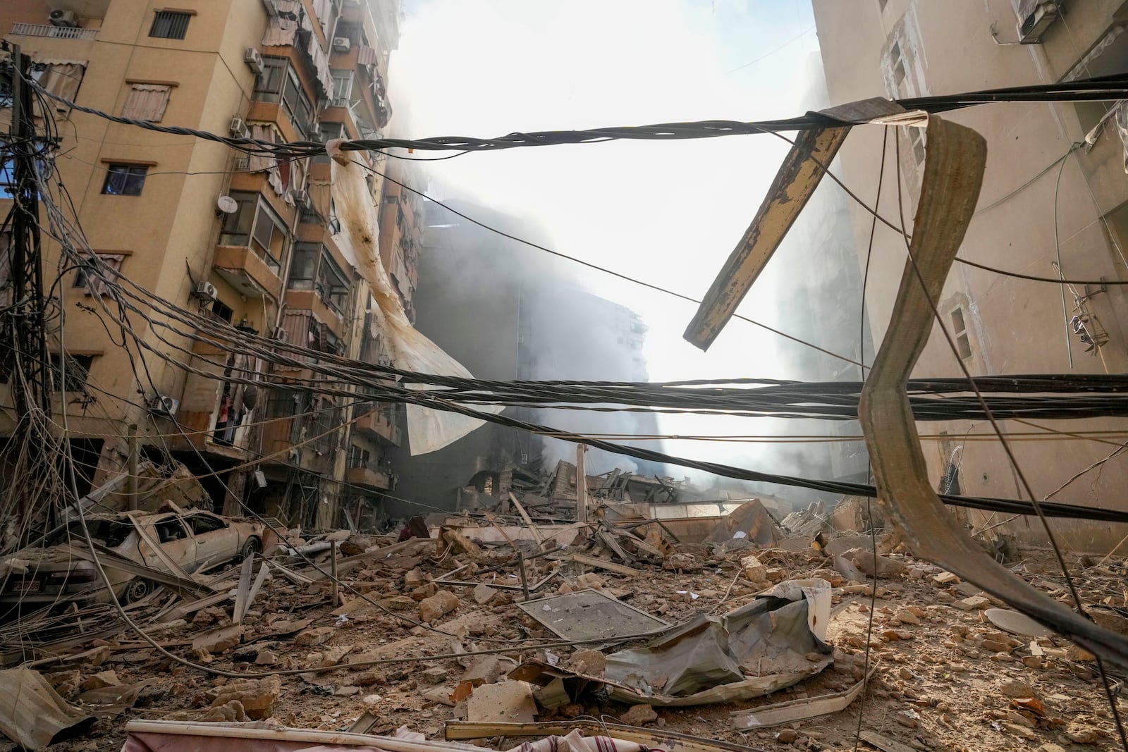 Smoke rises from the site of an Israeli airstrike in Dahiyeh, Beirut, Lebanon, Thursday, Oct. 3, 2024. (AP Photo/Hassan Ammar)