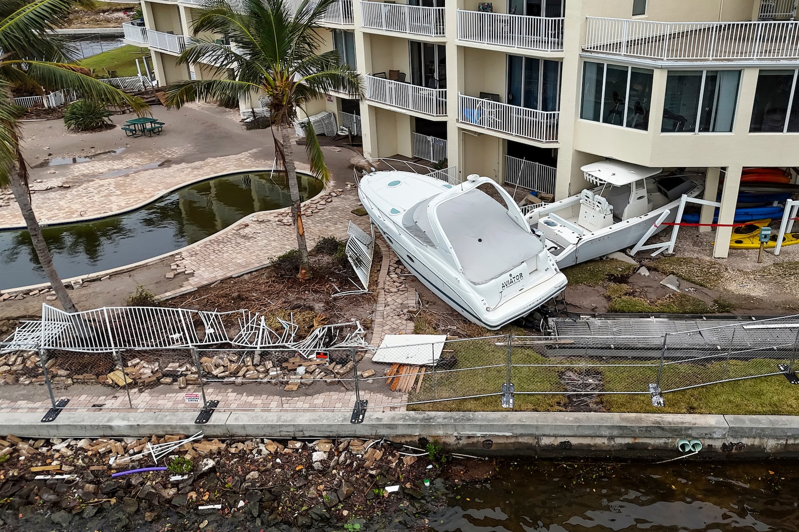 Boats sit after being pushed ashore by floodwaters from Hurricane Helene on Saturday, Sept. 28, 2024, in St. Petersburg, Fla. (AP Photo/Mike Carlson)