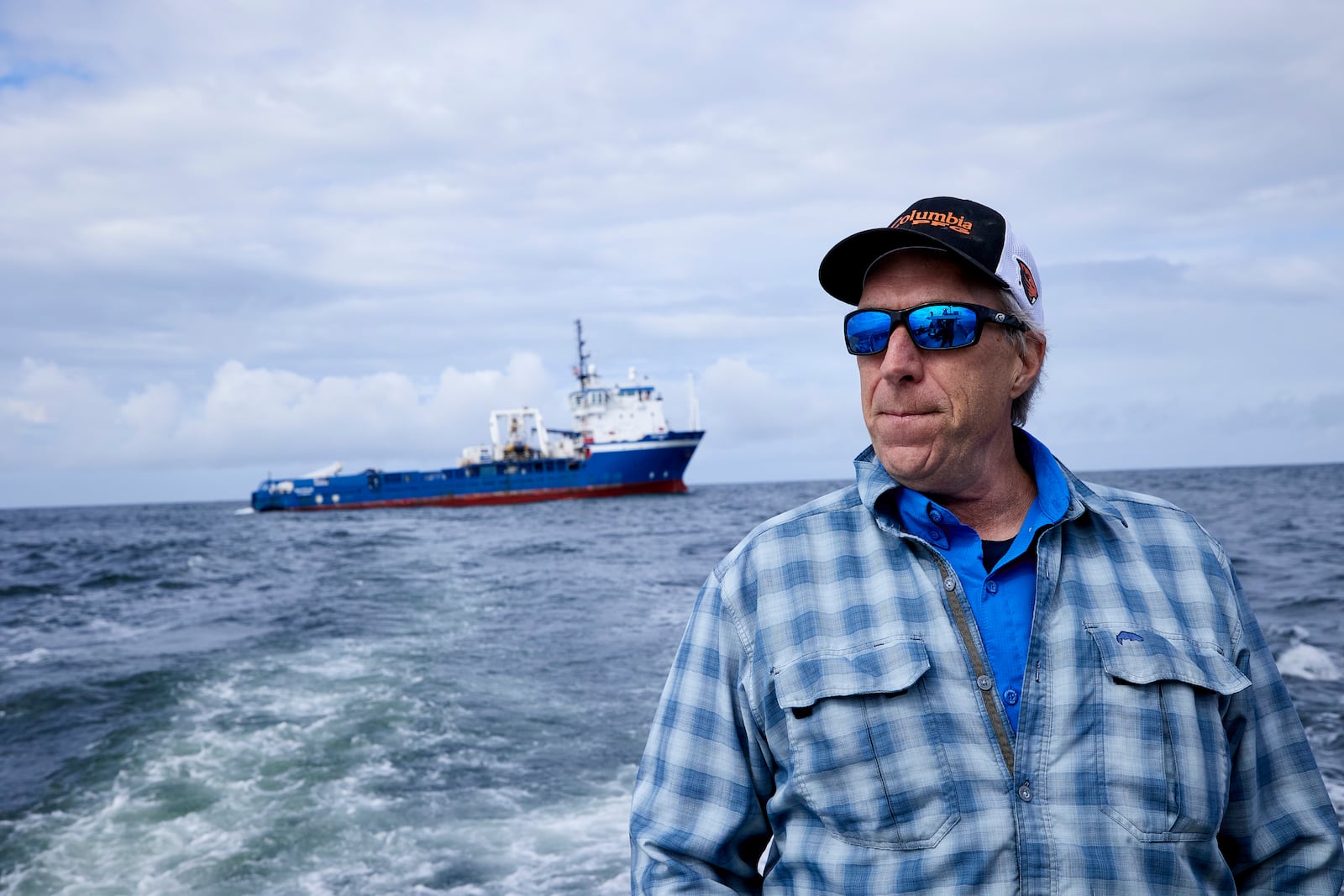 Burke Hales, chief scientist for the PacWave wave energy test site overseen by Oregon State University, looks on at the vessel Nautilus that helped bury the subsea cables that run along the ocean floor to connect the wave energy test site to facilities on land, near Newport, Ore., Friday, Aug. 23, 2024. (AP Photo/Craig Mitchelldyer)