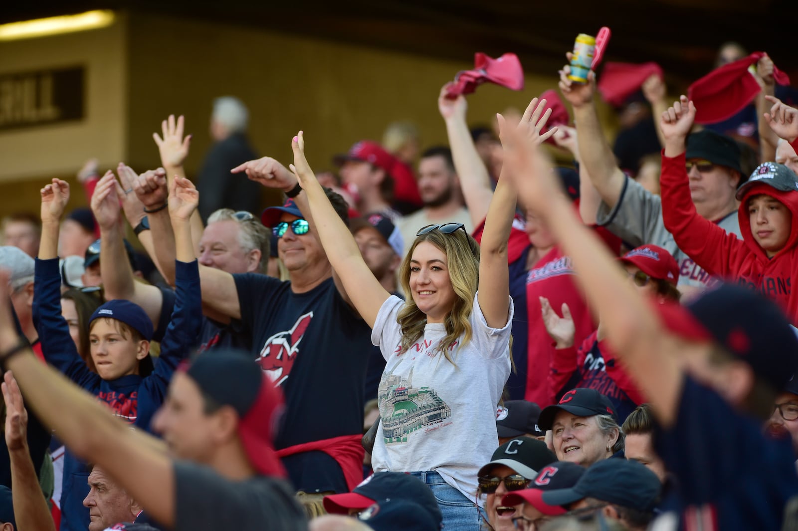 Fans cheer in the fifth inning during Game 1 of baseball's AL Division Series between the Detroit Tigers and the Cleveland Guardians, Saturday, Oct. 5, 2024, in Cleveland. (AP Photo/Phil Long)