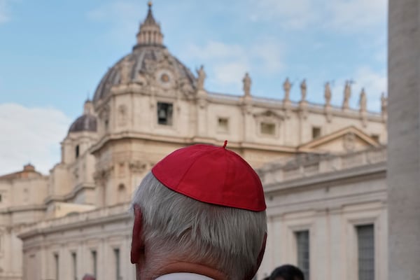 St Peter's Basilica is seen in the background as a cardinal arrives for a college of cardinals' meeting, at the Vatican, Monday, April 28, 2025. (AP Photo/Gregorio Borgia)