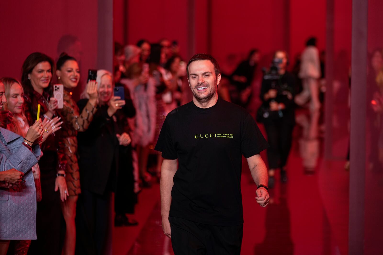 Sabato De Sarno, creative director of Gucci, accepts applause after the Gucci Spring Summer 2025 collection, that was presented in Milan, Italy, Friday, Sept. 20, 2024. (AP Photo/Luca Bruno).