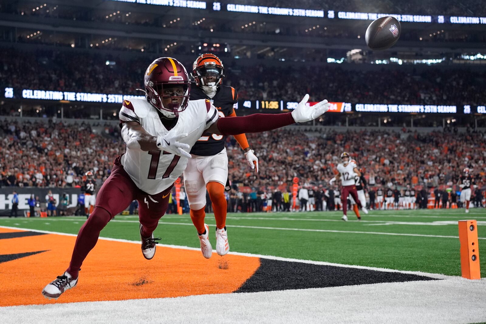 Washington Commanders wide receiver Terry McLaurin (17) reaches for an incomplete pass in front of Cincinnati Bengals cornerback Cam Taylor-Britt, rear, during the second half of an NFL football game, Monday, Sept. 23, 2024, in Cincinnati. (AP Photo/Carolyn Kaster)