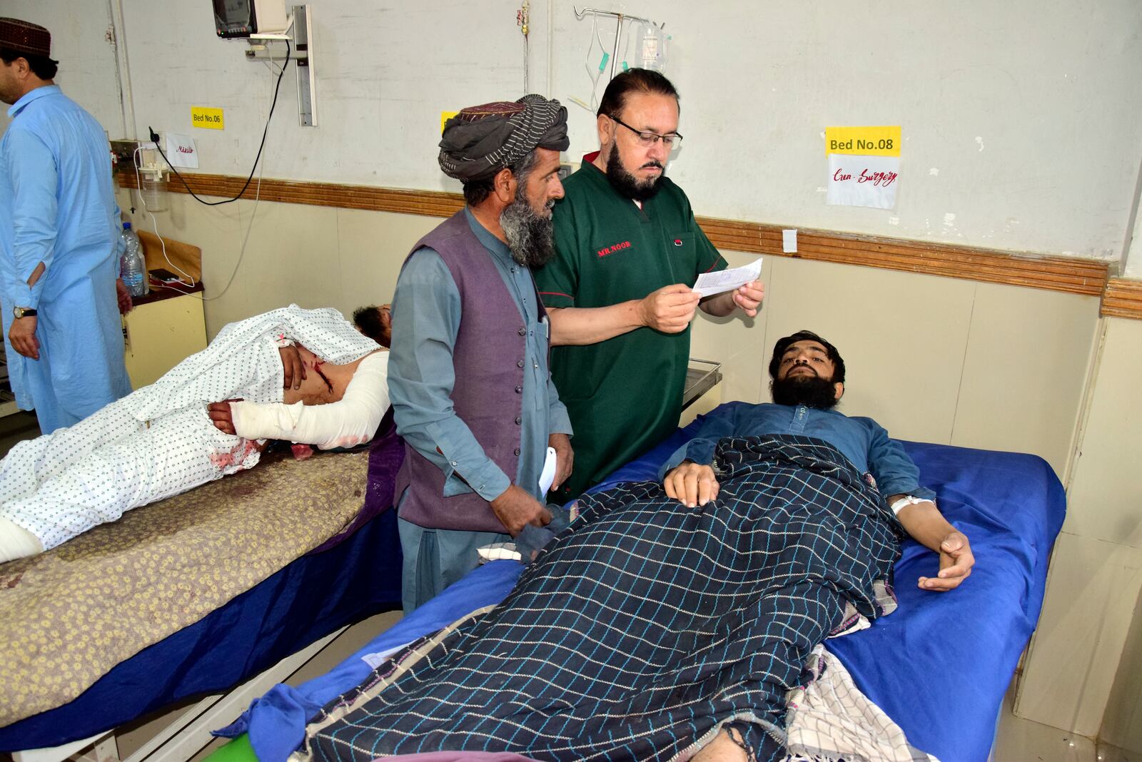 Injured men receive treatment at a hospital in Quetta, Pakistan, Friday, Oct. 11, 2024, following Thursday attack by gunmen in Balochistan province. (AP Photo/Arshad Butt)