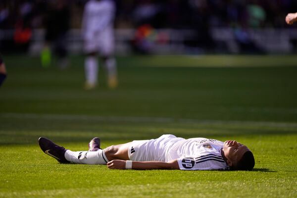 Real Madrid's Kylian Mbappe reacts after missing a chance to score during the Spanish La Liga soccer match between Barcelona and Real Madrid at the Lluis Companys Olympic Stadium in Barcelona, Spain, Sunday, May 11, 2025. (AP Photo/Jose Breton)