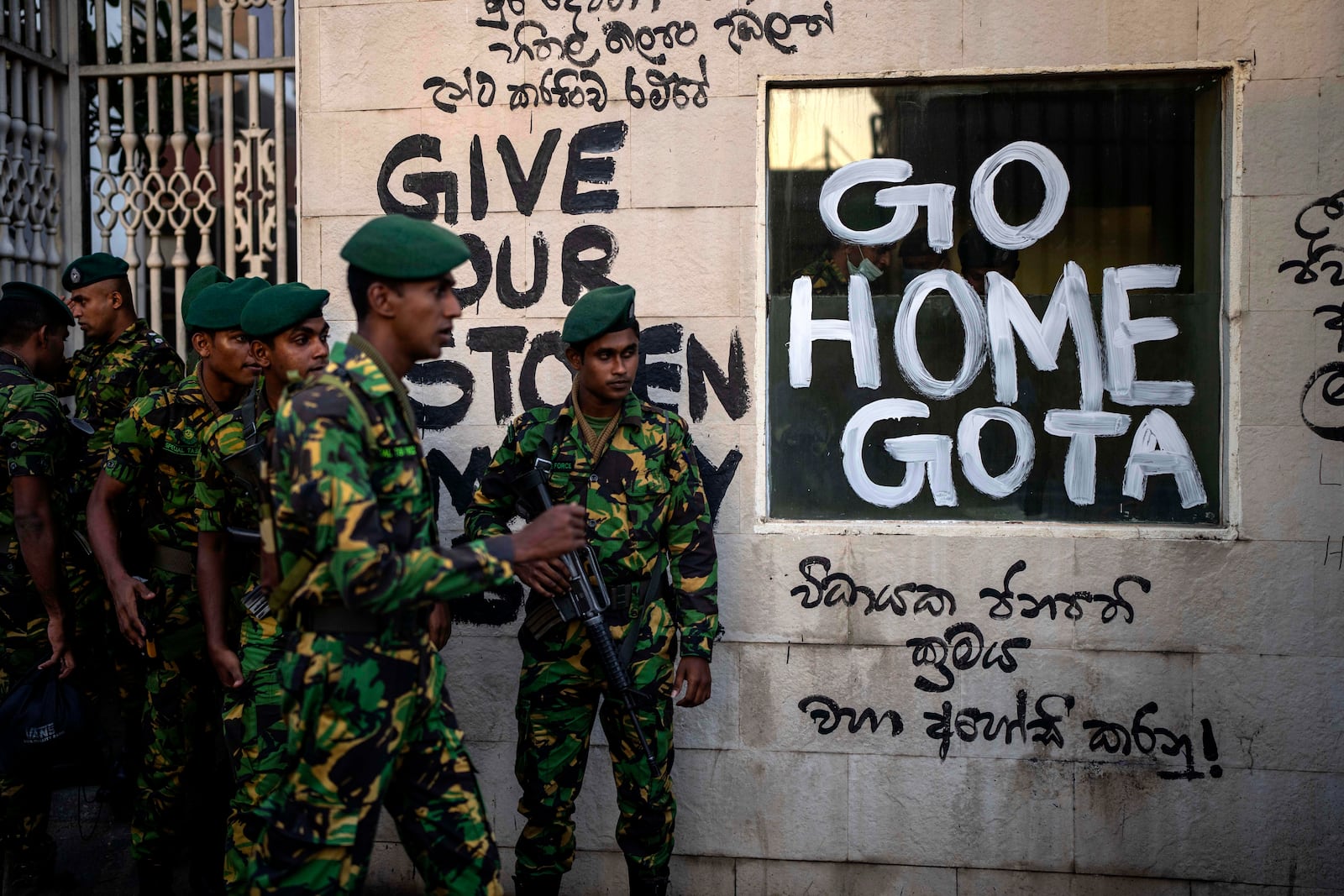 FILE - Sri Lanka army soldiers patrol near the official residence of president Gotabaya Rajapaksa three days after it was stormed by anti government protesters in Colombo in Colombo, Sri Lanka, on July 12, 2022. (AP Photo/Rafiq Maqbool, File)