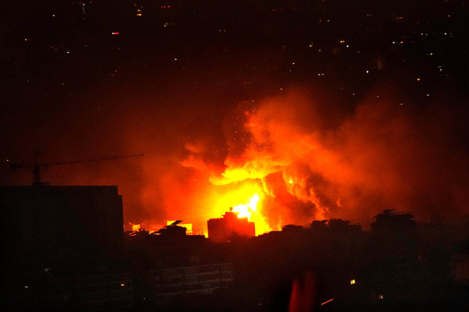 Flames and smoke rise from an Israeli airstrike in Dahiyeh, Beirut, Lebanon, early Sunday, Oct. 6, 2024. (AP Photo/Hussein Malla)