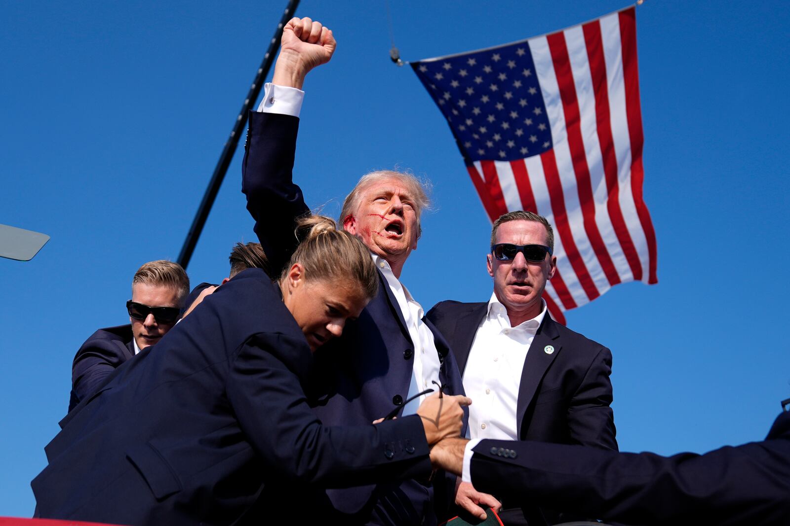 FILE - Republican presidential candidate former President Donald Trump is surrounded by U.S. Secret Service agents at a campaign rally, July 13, 2024, in Butler, Pa. (AP Photo/Evan Vucci, File)