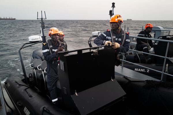 Senegalese sailors prepare their zodiacs during a mission to search for illegal migrant boats near the coast of Dakar, Senegal, Saturday, Nov.16, 2024. (AP Photo/Sylvain Cherkaoui)