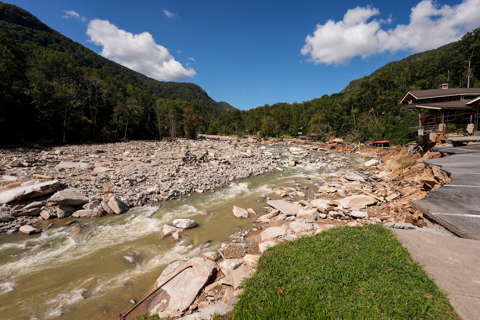 Debris covers a field in the aftermath of Hurricane Helene, Wednesday, Oct. 2, 2024, in Chimney Rock Village, N.C. (AP Photo/Mike Stewart)