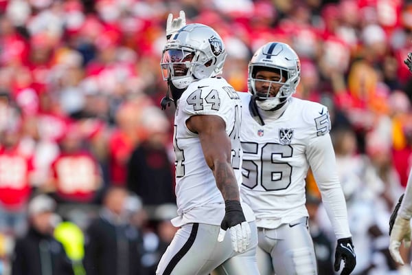 Las Vegas Raiders defensive end K'Lavon Chaisson (44) celebrates after a sack against the Kansas City Chiefs during the first half of an NFL football game in Kansas City, Mo., Friday, Nov. 29, 2024. (AP Photo/Ed Zurga)