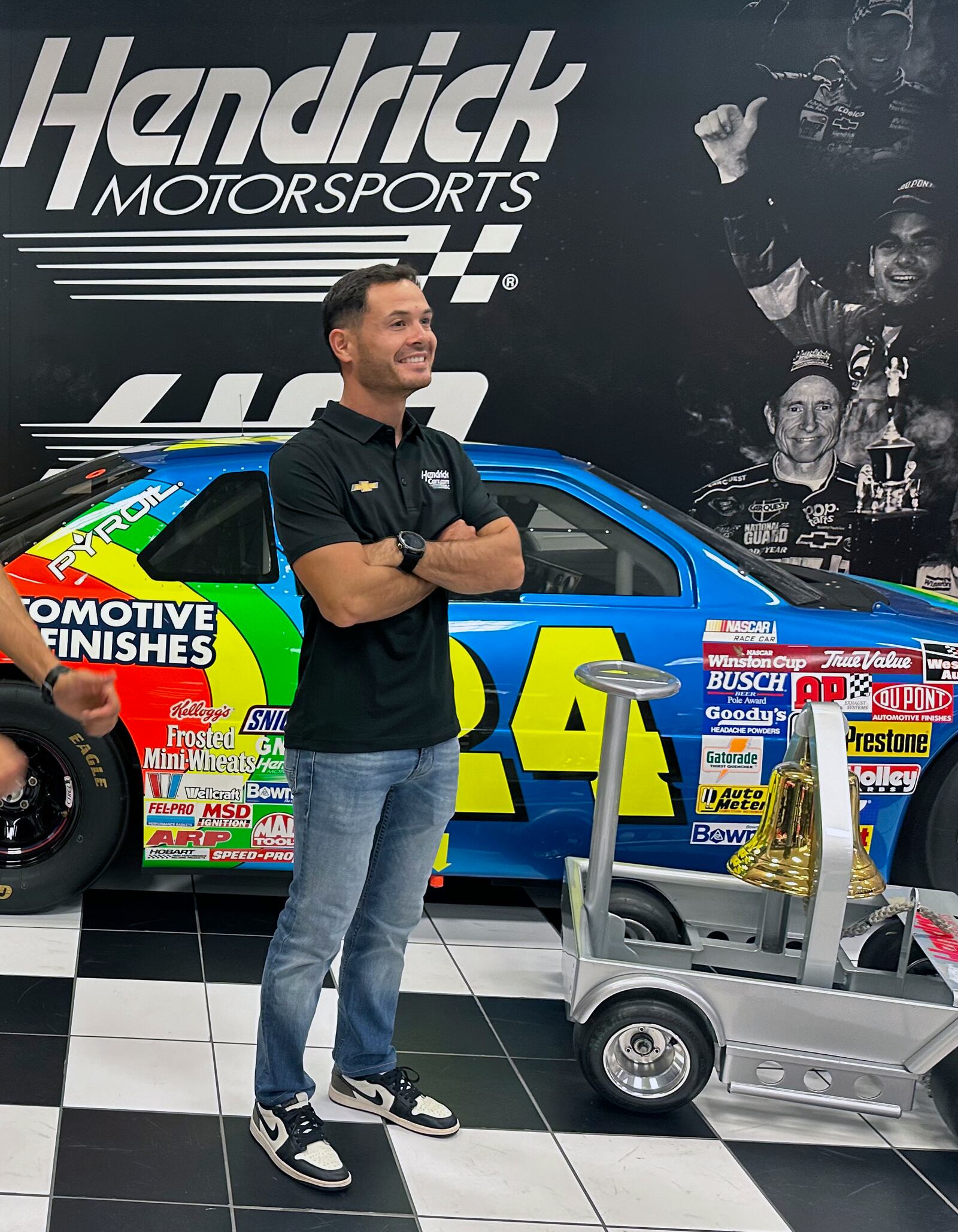 NASCAR driver Kyle Larson poses during the victory bell ringing ceremony for Larson’s win at Bristol Motor Speedway, Oct. 9, 2024, at Hendrick Motorsports in Charlotte, N.C. (AP Photo/Jenna Fryer)