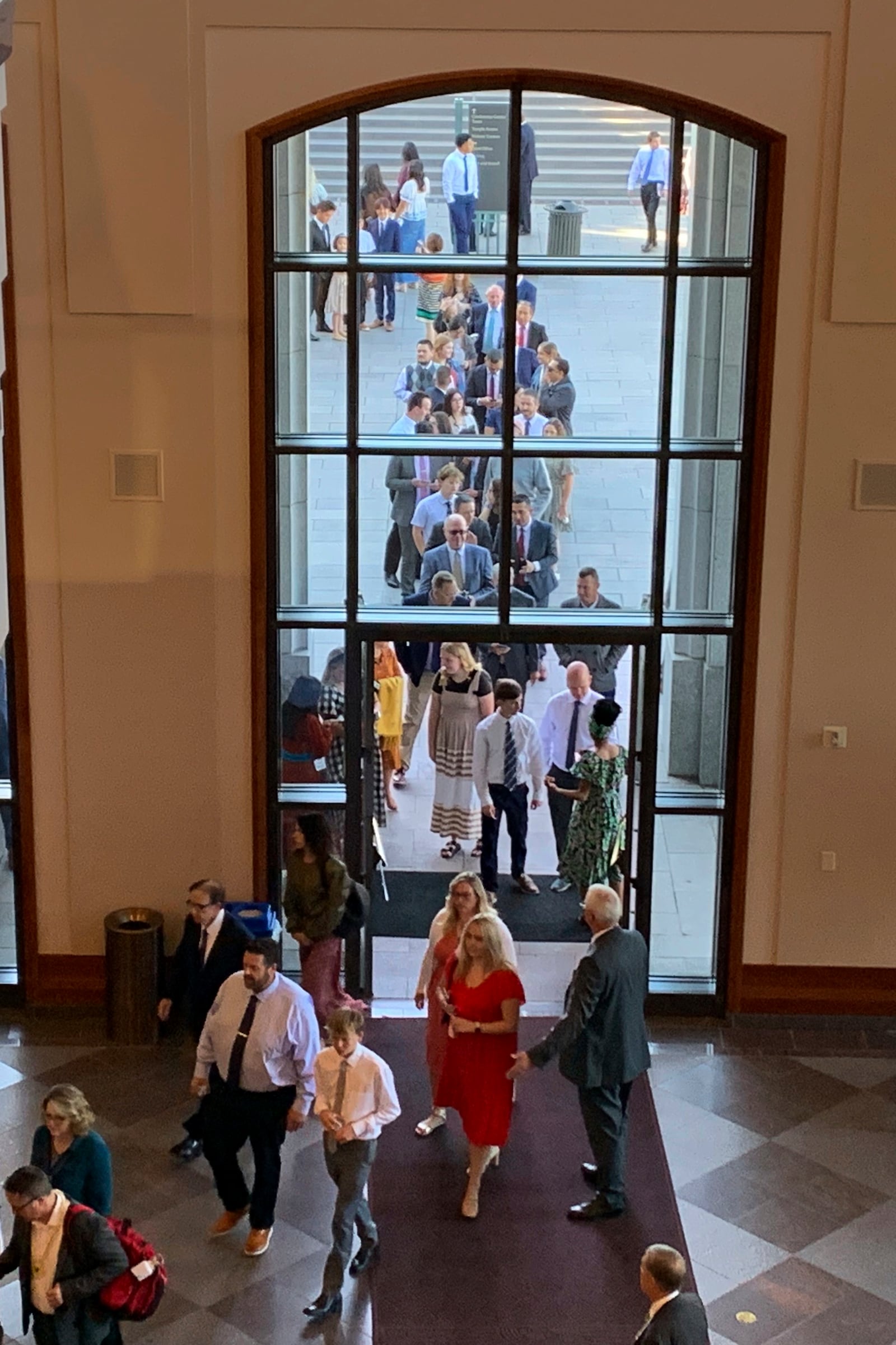 Members of The Church of Jesus Christ of Latter-day Saints file into the church conference center for the faith's twice-annual general conference on Saturday, Oct. 5, 2024, in Salt Lake City, Utah. (AP Photo/Hannah Schoenbaum)