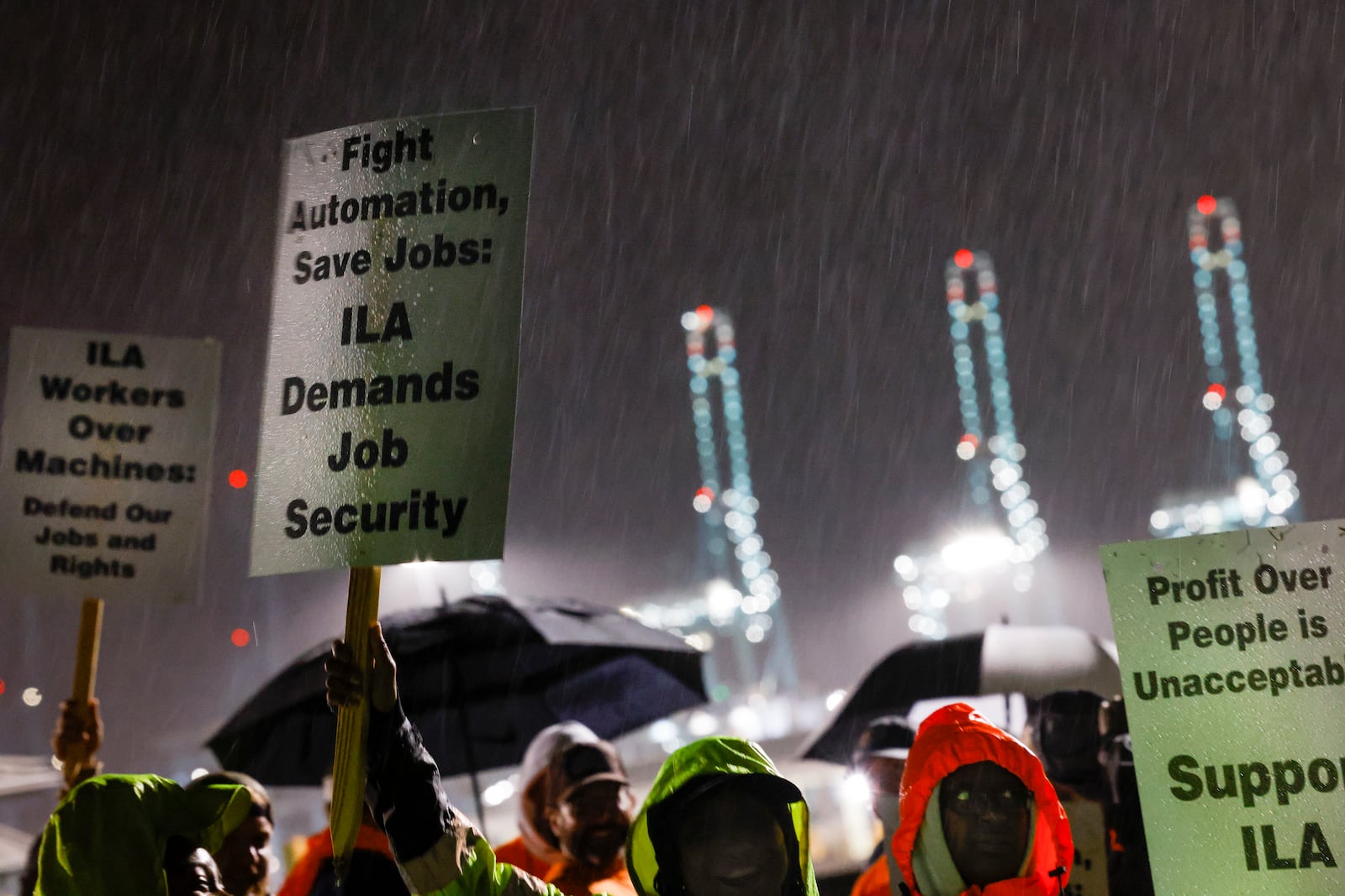 Hundreds of longshoremen strike together outside of the Virginia International Gateway in Portsmouth, Va., Tuesday, Oct. 1, 2024. (Billy Schuerman/The Virginian-Pilot via AP)