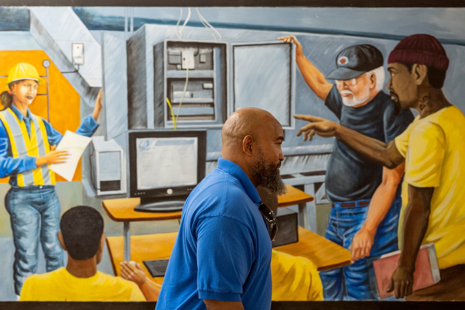 Jackie Robinson, an instructor at the Energy Coordinating Agency, a nonprofit focused in part on energy equity, works inside the facility on Tuesday, July 2, 2024, in Philadelphia. (AP Photo/Joe Lamberti)