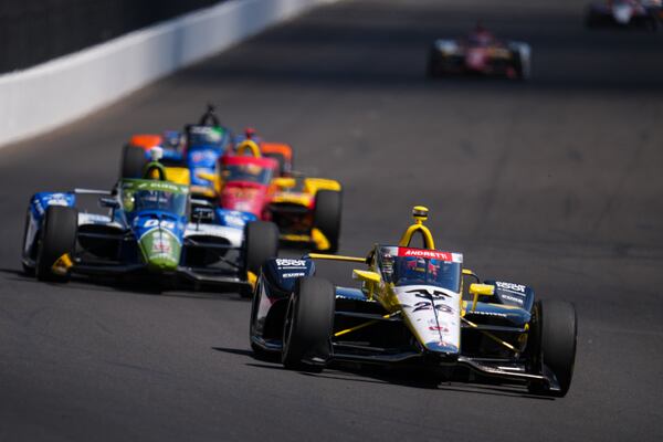 Colton Herta drives into the first turn during practice for the Indianapolis 500 auto race at Indianapolis Motor Speedway in Indianapolis, Friday, May 23, 2025. (AP Photo/Michael Conroy)