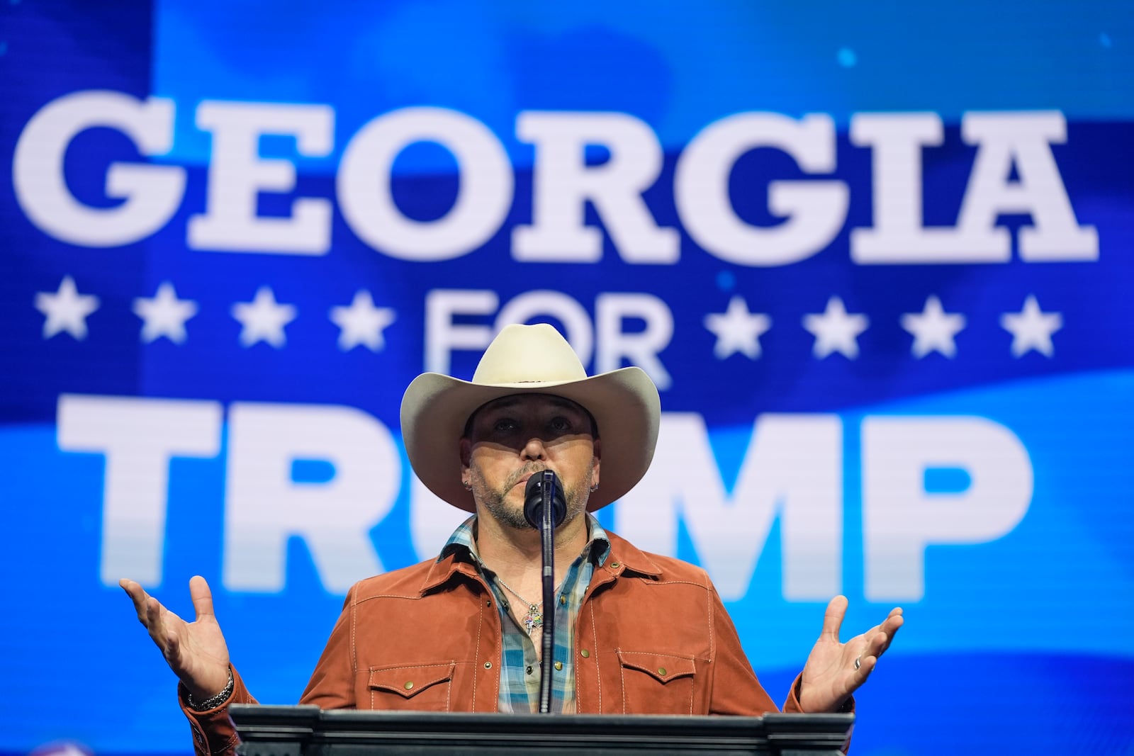 Jason Aldean speaks before Republican presidential nominee former President Donald Trump at a Turning Point Action campaign rally, Wednesday, Oct. 23, 2024, in Duluth, Ga. (AP Photo/Alex Brandon)