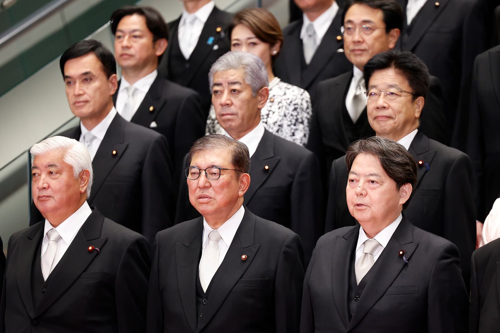 Japan's Prime Minister Shigeru Ishiba, second from right, and his cabinet ministers pose for a photo session at Ishiba's residence in Tokyo, Japan, Tuesday, Oct. 1, 2024. Rodrigo Reyes Marin, Pool Photo via AP)