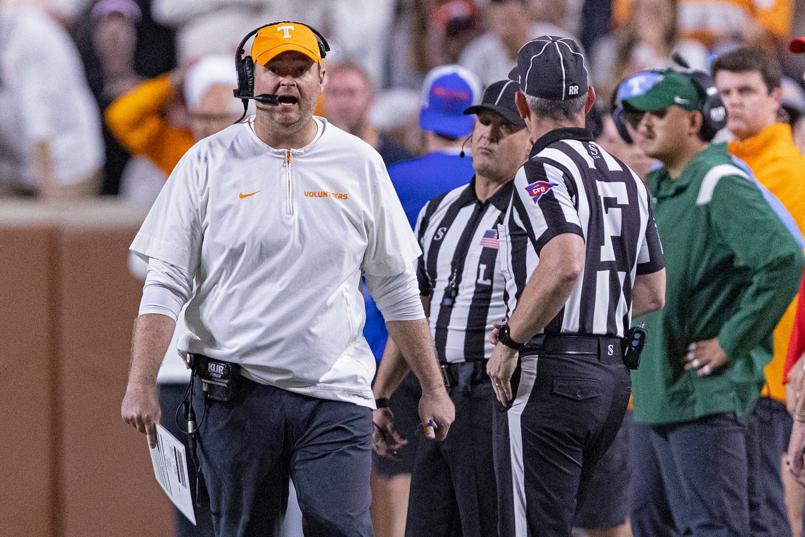 Tennessee head coach Josh Heupel, left, yells to field judge Phillip Davenport during the second half of an NCAA college football game against Florida, Saturday, Oct. 12, 2024, in Knoxville, Tenn. (AP Photo/Wade Payne)