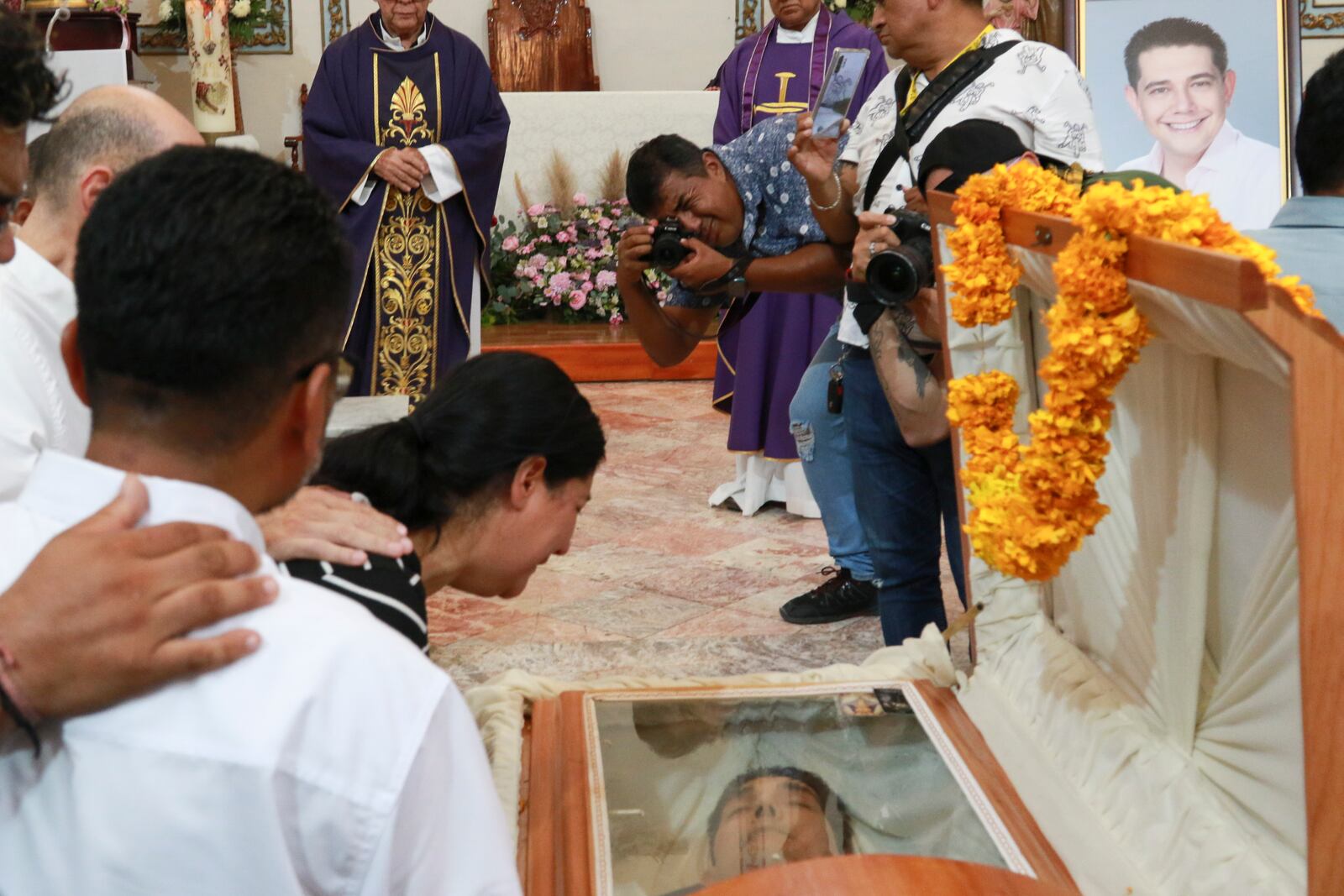 Relatives of slain Mayor Alejandro Arcos cry during his funeral service, one week after he took office, in Chilpancingo, Guerrero state, Mexico, Monday, Oct. 7, 2024. (AP Photo/Alejandrino Gonzalez)