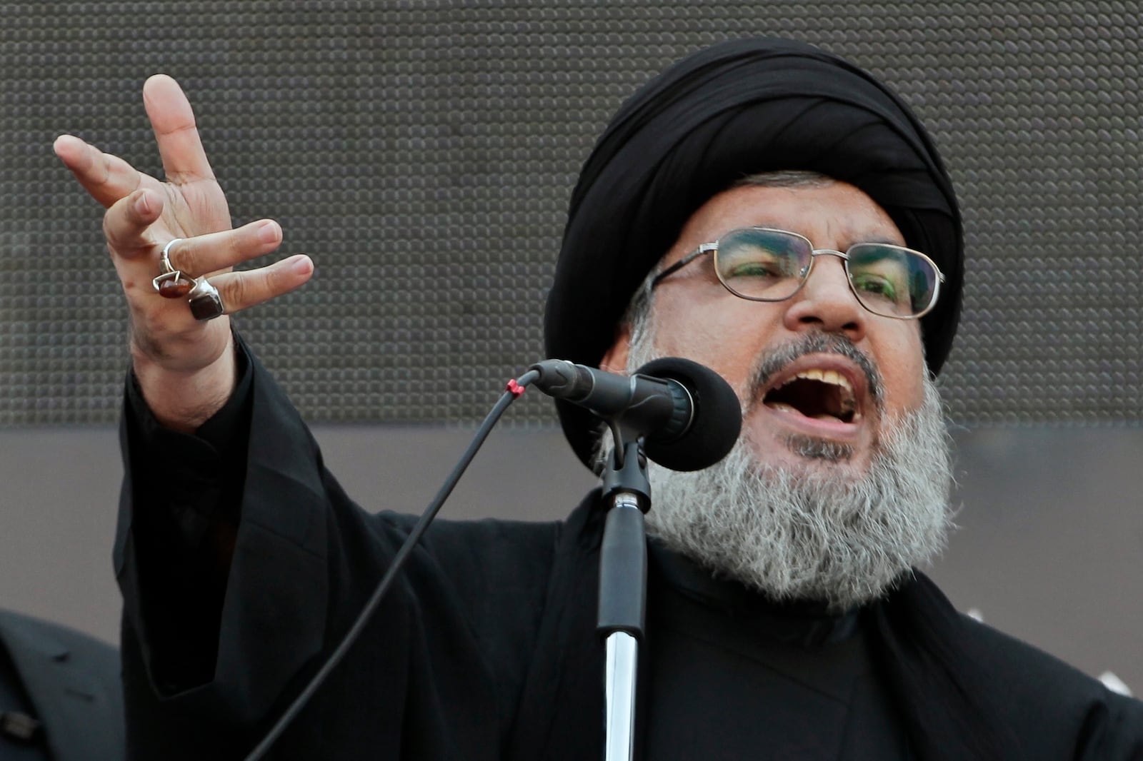 FILE - Hezbollah leader Sheik Hassan Nasrallah, speaks to the crowd in a rare public appearance during Ashura, that marks the death of Shiite Islam's Imam Hussein, in the suburbs of Beirut, Thursday, Nov. 14, 2013. (AP Photo/Bilal Hussein, File)