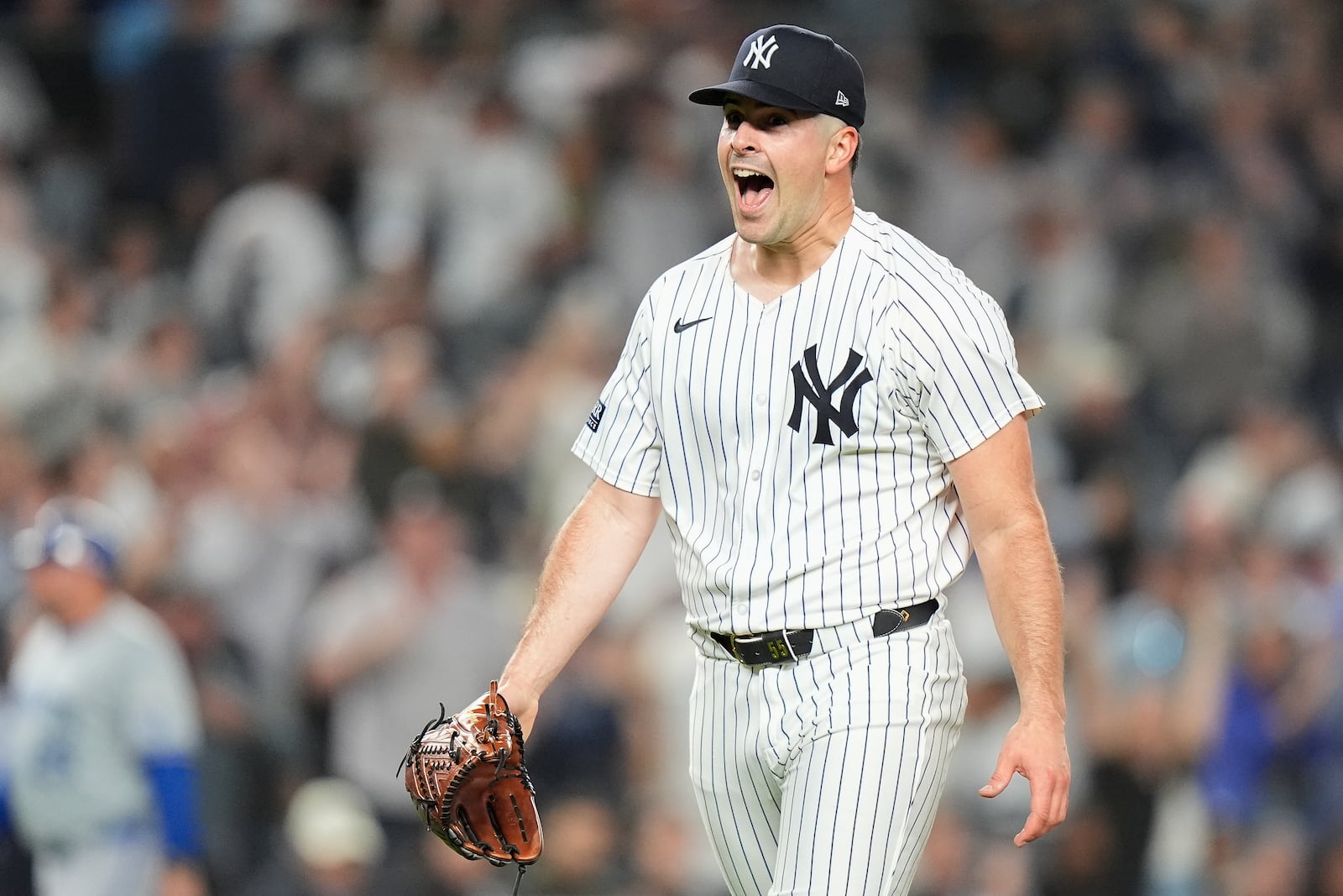 New York Yankees pitcher Carlos Rodón reacts after striking out the Kansas City Royals to end the top of the first inning of Game 2 of the American League baseball playoff series, Monday, Oct. 7, 2024, in New York. (AP Photo/Frank Franklin II)