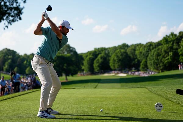 Scottie Scheffler hits his tee shot on the 15th hole during the third round of the PGA Championship golf tournament at the Quail Hollow Club, Saturday, May 17, 2025, in Charlotte, N.C. (AP Photo/David J. Phillip)