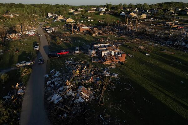 Homes are destroyed after a severe storm passed through the area, Saturday, May 17, 2025, in London, Ky. (AP Photo/Carolyn Kaster)