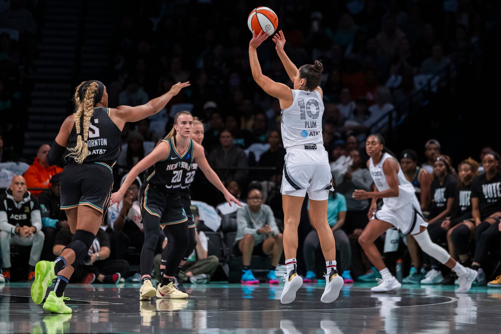 Las Vegas Aces guard Kelsey Plum (10) shoots a 3 point basket during the first half of a WNBA basketball second-round playoff game against the New York Liberty, Sunday, Sept. 29, 2024, in New York. (AP Photo/Corey Sipkin)