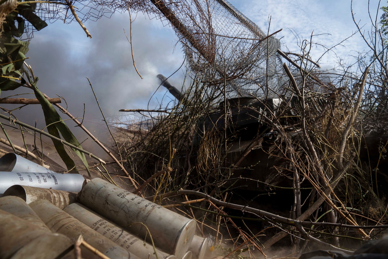 Ukrainian servicemen, not in the picture, of 56th brigade fire by self-propelled artillery towards Russian positions at the frontline on Chasiv Yar direction, Donetsk region, Ukraine, Sept. 27, 2024. (AP Photo/Evgeniy Maloletka)