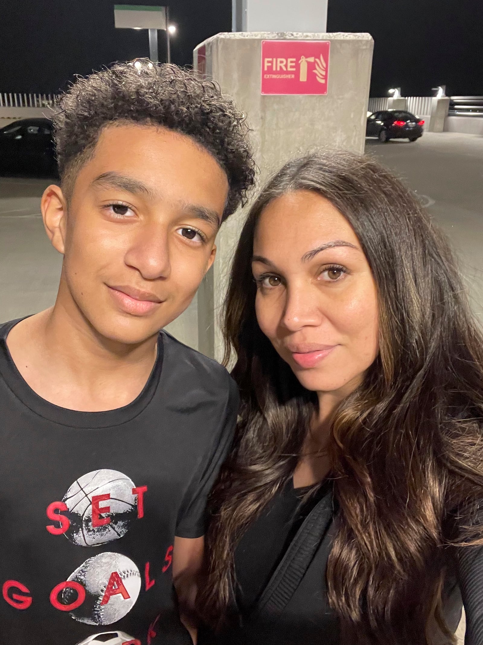 In this undated photo provided by Megan Garcia of Florida in October 2024, she stands with her son, Sewell Setzer III. (Megan Garcia via AP)