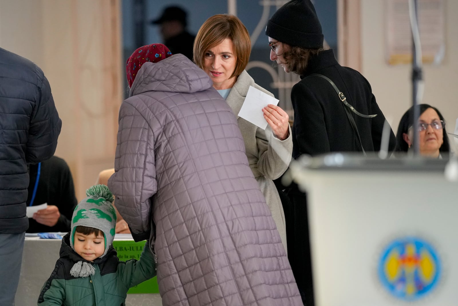 Moldova's President Maia Sandu arrives to cast her vote during a presidential election runoff, in Chisinau, Moldova, Sunday, Nov. 3, 2024. (AP Photo/Vadim Ghirda)