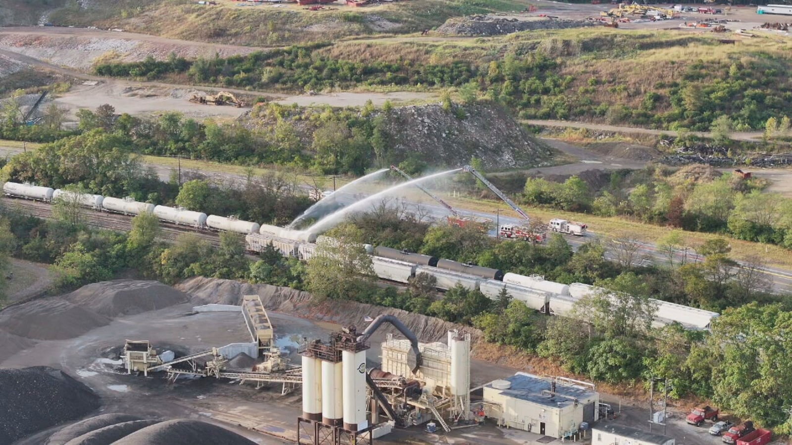 Firefighters work on the scene of a chemical leak in railcars near Cleves, Ohio, Tuesday, Sept. 24, 2024. (Local 12/WKRC via AP)