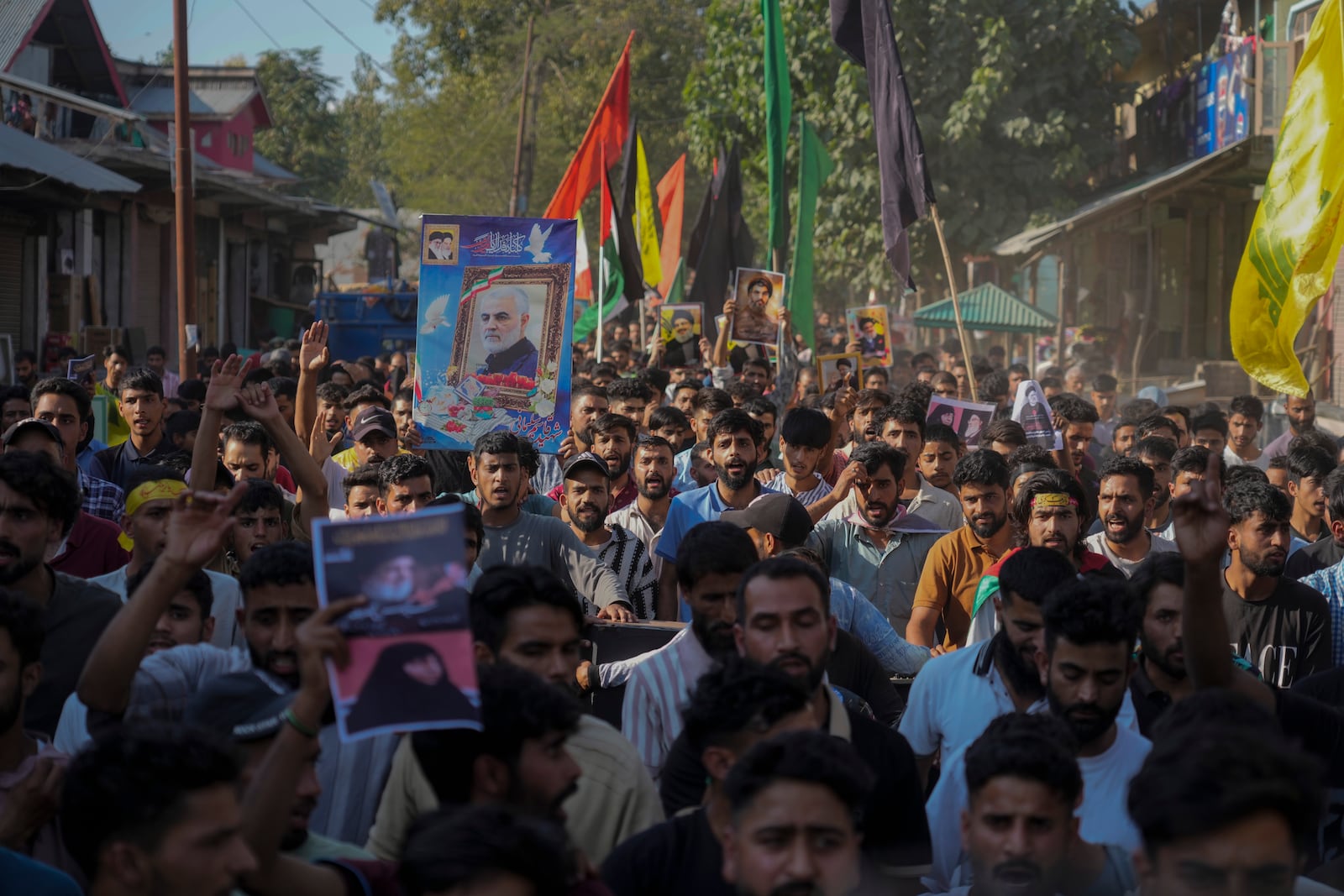 Kashmiri Shiite Muslims shout pro-Palestine and anti-Israel slogans during a protest in solidarity with Palestine and against the killing of Hezbollah leader Hassan Nasrallah, at Mirgund north village of Srinagar, Indian controlled Kashmir, Friday, Oct. 4, 2024. (AP Photo/Mukhtar Khan)