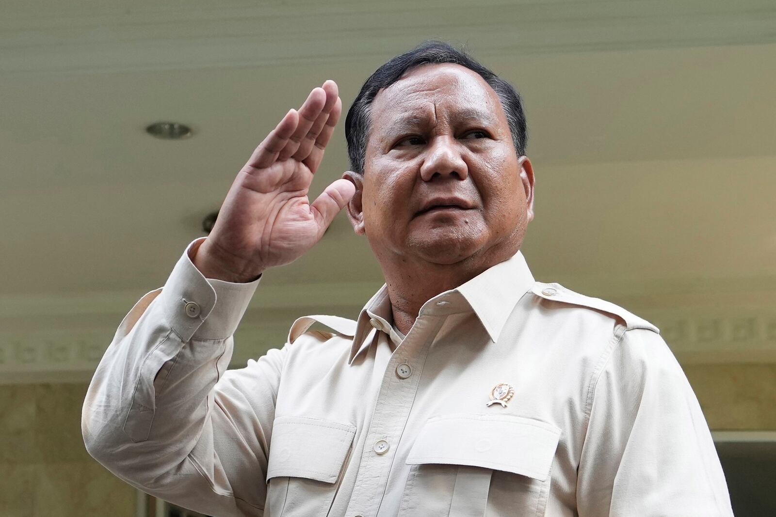 FILE - Indonesian Defense Minister Prabowo Subianto waves at journalists in Jakarta, Indonesia, Tuesday, Feb. 20, 2024. (AP Photo/Achmad Ibrahim, File)