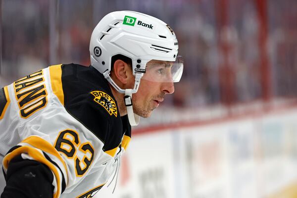 Boston Bruins' Brad Marchand (63) watches the puck against the Carolina Hurricanes during the first period of an NHL hockey game in Raleigh, N.C., Thursday, Oct. 31, 2024. (AP Photo/Karl B DeBlaker)