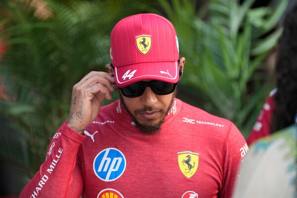 Ferrari driver Lewis Hamilton of Britain gestures prior to the start of the third free practice ahead of the Formula One Saudi Arabian Grand Prix at the Jeddah Corniche Circuit in Jeddah, Saudi Arabia, Saturday, April 19, 2025. (AP Photo/Darko Bandic)