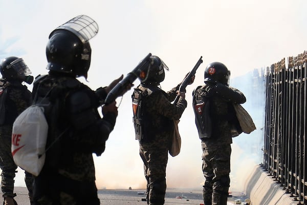 Paramilitary soldiers fire rubber bullets and tear gas shells to disperse supporters of imprisoned former premier Imran Khan's Pakistan Tehreek-e-Insaf party, during clashes at D-Chowk square close to Red Zone in Islamabad, Pakistan, Tuesday, Nov. 26, 2024. (AP Photo/Ehsan Shahzad)