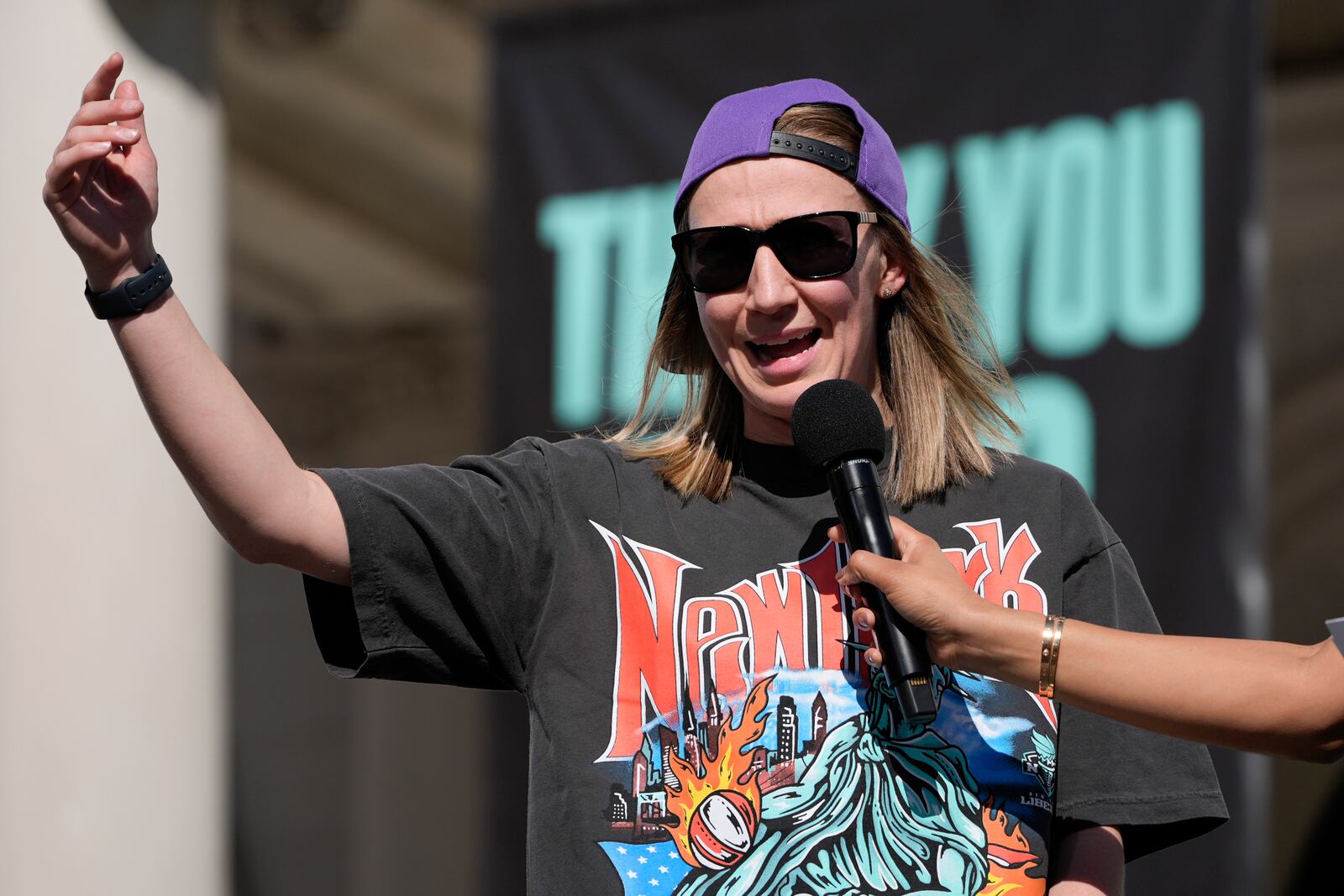 New York Liberty Courtney Vandersloot talks to fans during a ceremony in honor of the Liberty's WNBA championship at City Hall in New York, Thursday, Oct. 24, 2024. (AP Photo/Seth Wenig)