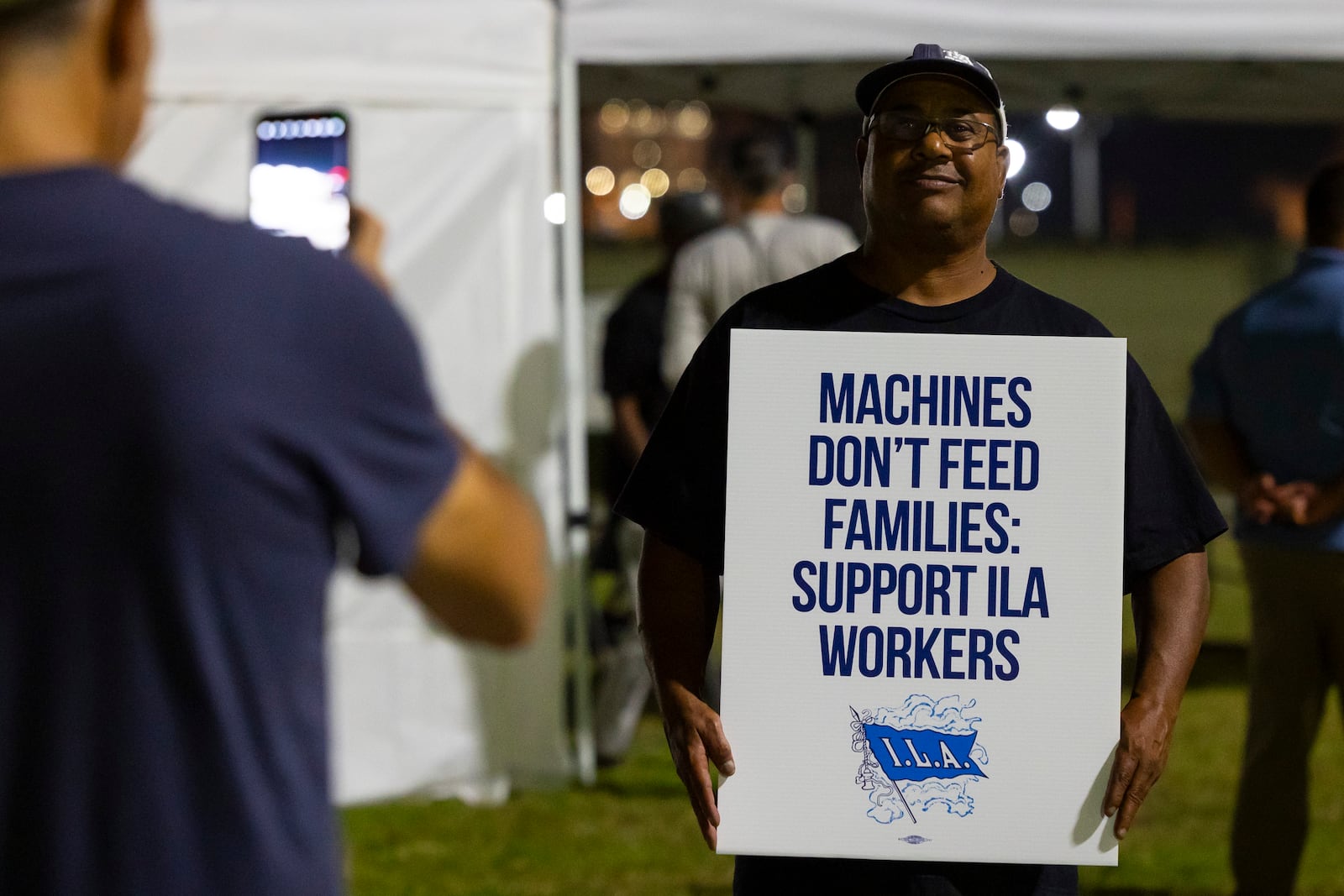 Longshoremen strike at midnight at Bayport Terminal on Tuesday, Oct. 1, 2024, in Houston. (AP Photo/Annie Mulligan)