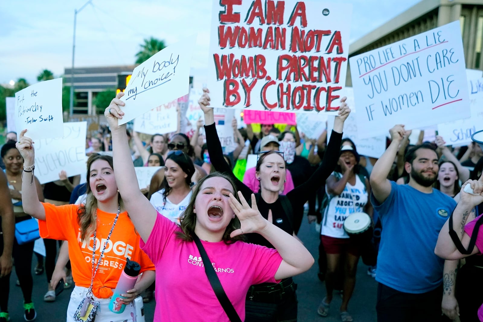 FILE - Protesters join thousands marching around the Arizona Capitol in Phoenix, protesting the U.S. Supreme Court's decision to overturn Roe v. Wade, June 24, 2022. (AP Photo/Ross D. Franklin, File)