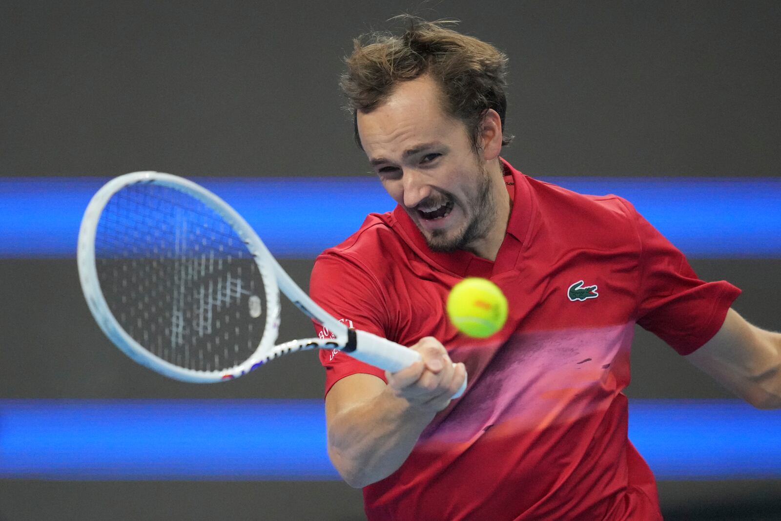 Daniil Medvedev of Russia returns a shot from Carlos Alcaraz of Spain during their men's singles semi-final match for the China Open tennis tournament held at the National Tennis Center in Beijing, Tuesday, Oct. 1, 2024.(AP Photo/Achmad Ibrahim)