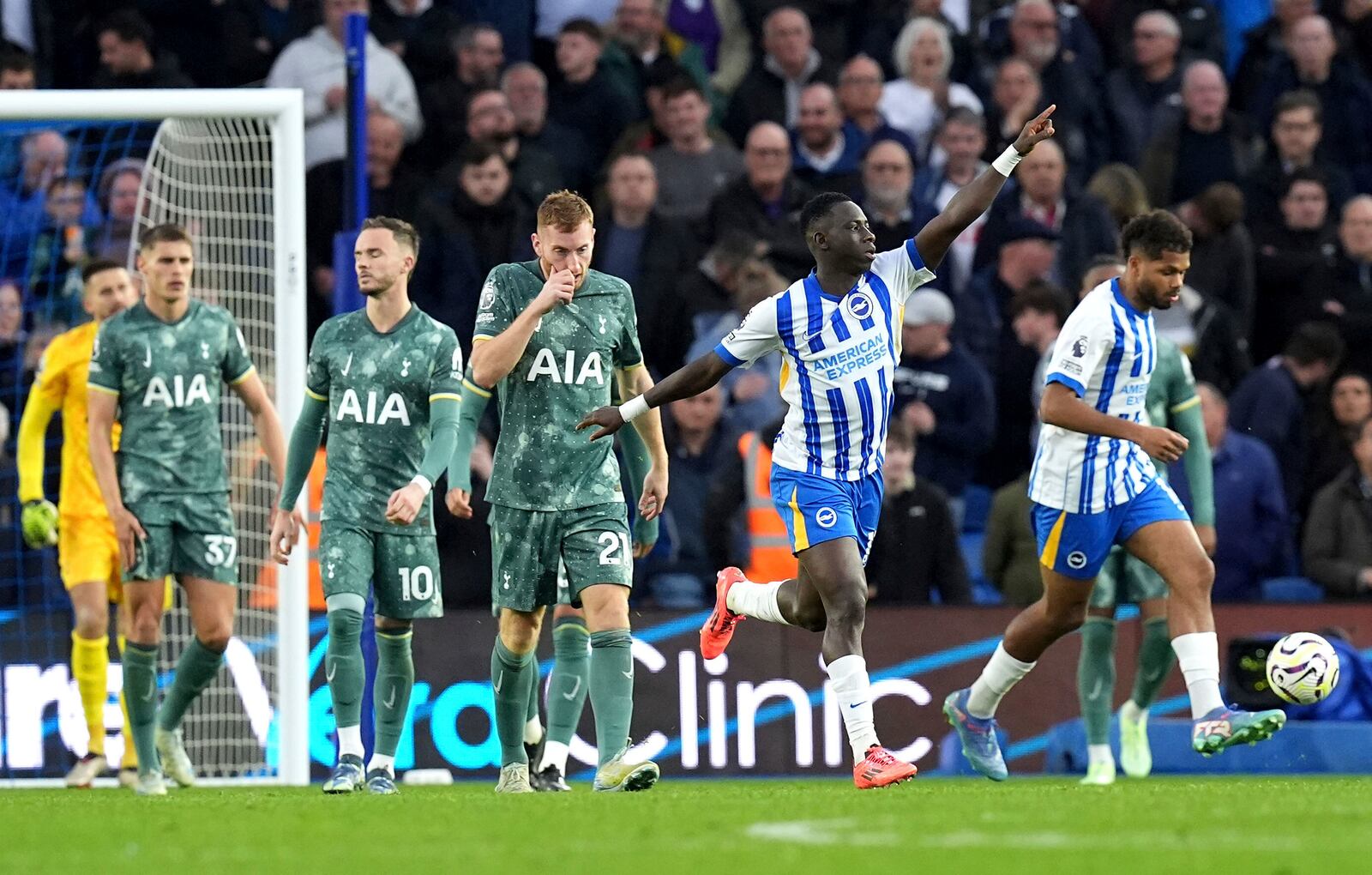 Brighton and Hove Albion's Yankuba Minteh, second right, celebrates scoring their side's first goal of the game during the Premier League match at the American Express Stadium, Brighton, England, Sunday Oct. 6, 2024. (Gareth Fuller/PA via AP)