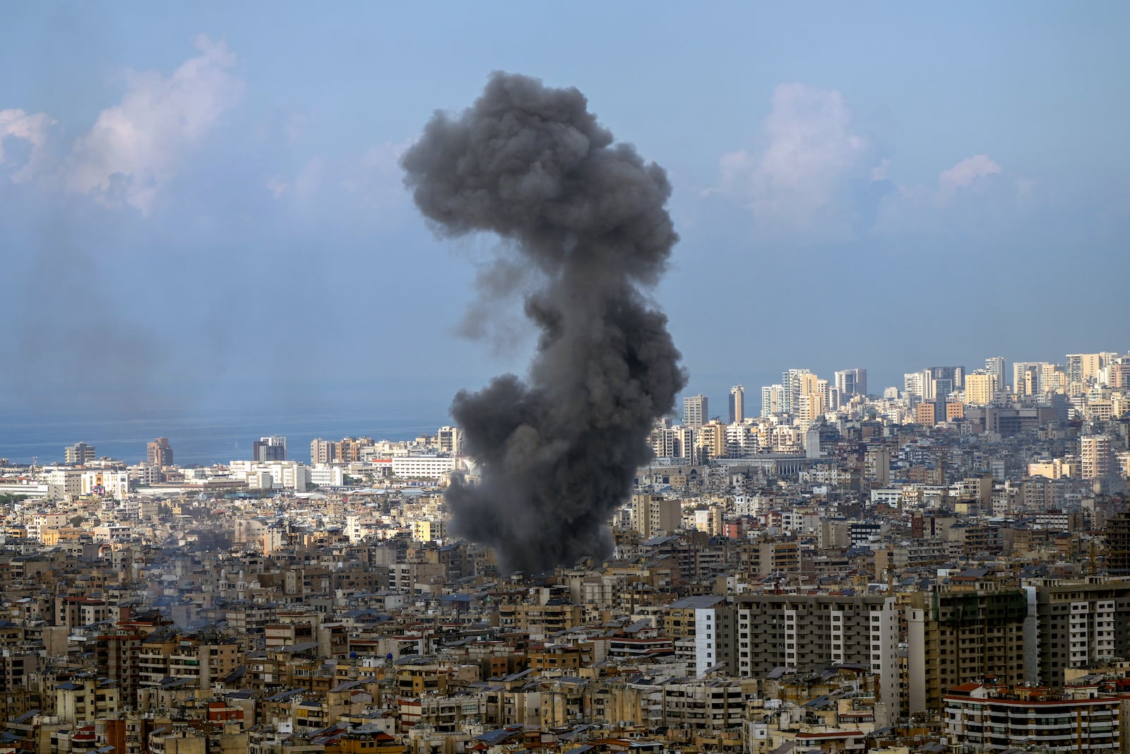 Smoke rises after an Israeli airstrike on Dahiyeh, in the southern suburb of Beirut, Lebanon, Wednesday, Nov. 13, 2024. (AP Photo/Hassan Ammar)