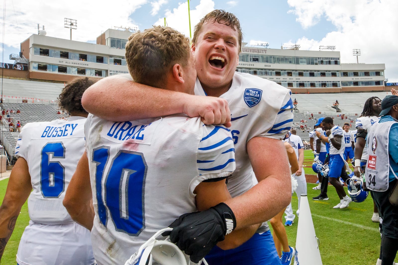 Memphis wide receiver Koby Drake (10) and offensive lineman Jonah Gambill (65) celebrate after defeating Florida State 20-14 in a NCAA college football game, Saturday, Sept. 14, 2024, in Tallahassee, Fla. (AP Photo/Colin Hackley)